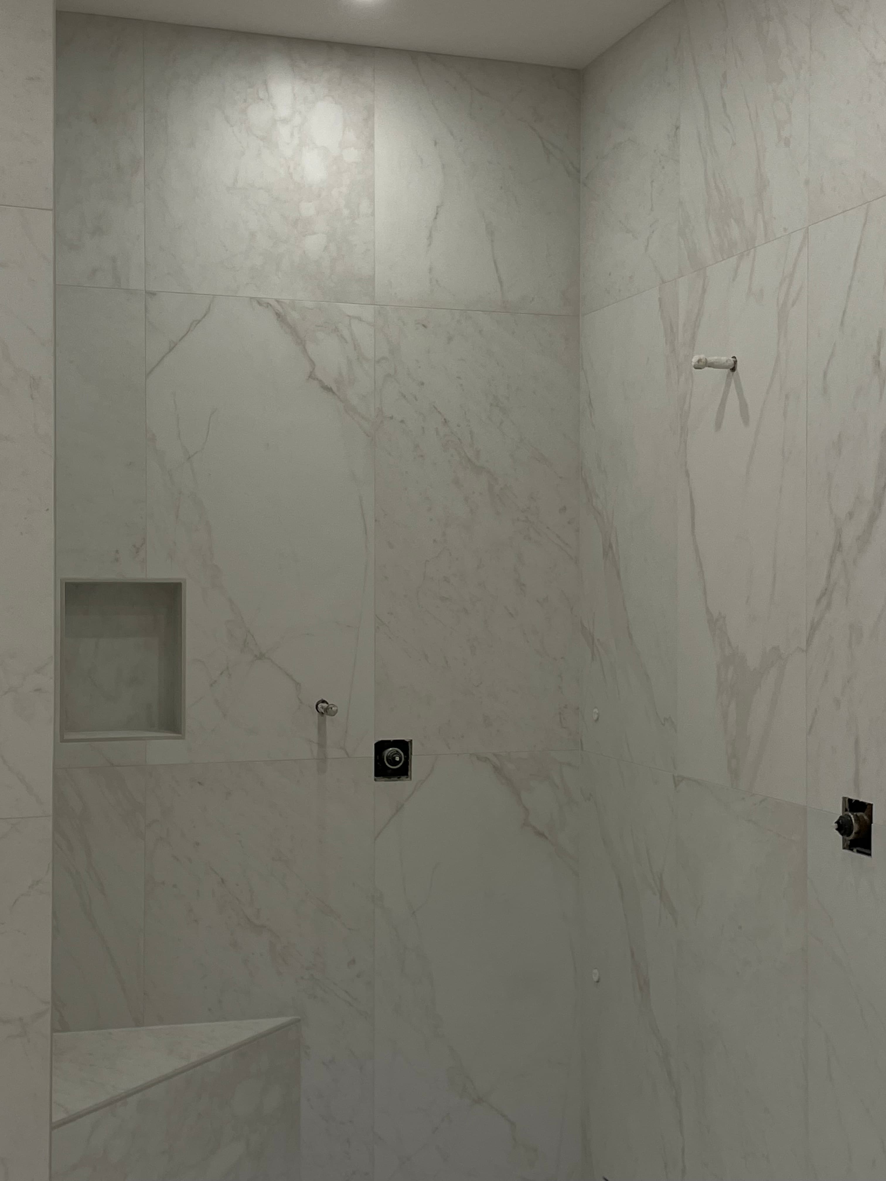 Marble shower with recessed niche